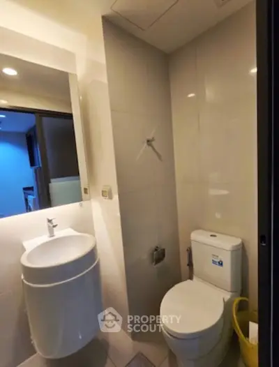 Modern bathroom with sleek fixtures and elegant design in a contemporary apartment.