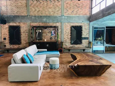 Stunning industrial-style living room with unique wooden table and modern sofa
