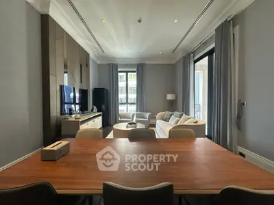 Spacious modern living room with elegant decor and large windows