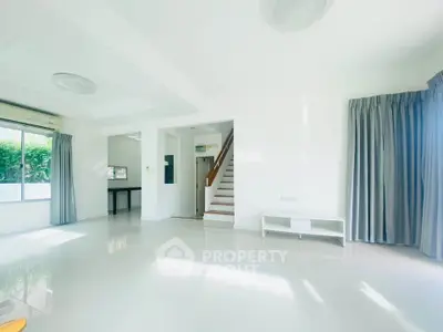 Spacious and bright living room with modern design and large windows