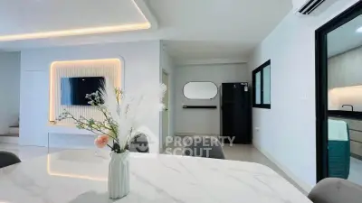 Modern open-plan living area with sleek kitchen and stylish decor