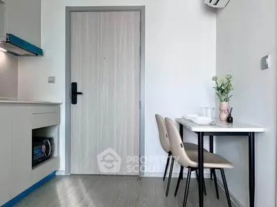 Modern compact kitchen with dining area in a stylish apartment