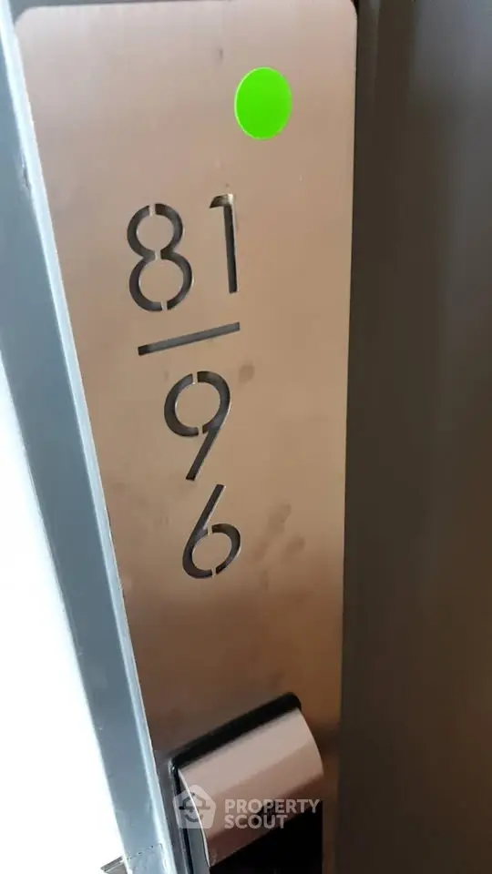 Modern apartment entrance with sleek door number design