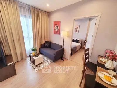Cozy modern living room with adjoining bedroom in stylish apartment