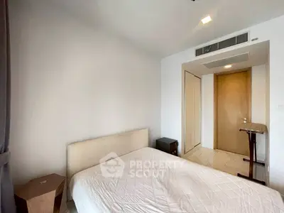 Modern minimalist bedroom with sleek design and neutral tones