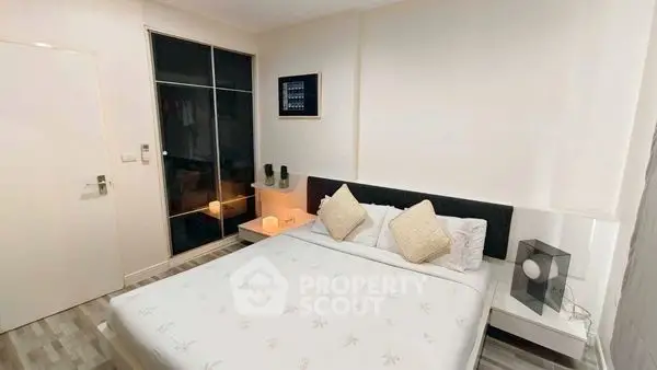 Cozy bedroom with modern decor and ample storage space