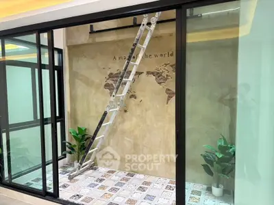 Stylish indoor space with world map mural and decorative tiles, perfect for modern living.