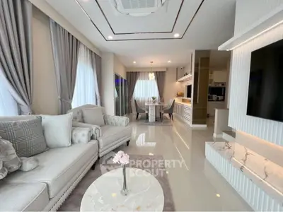 Luxurious modern living room with elegant decor and open kitchen layout