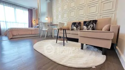 Modern open-plan living room with stylish decor and cozy seating area