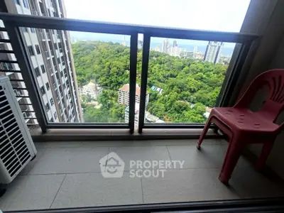 Stunning high-rise balcony with panoramic city and nature views, perfect for relaxation and enjoying the scenery.