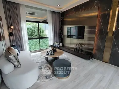 Luxurious modern living room with elegant decor and large window view