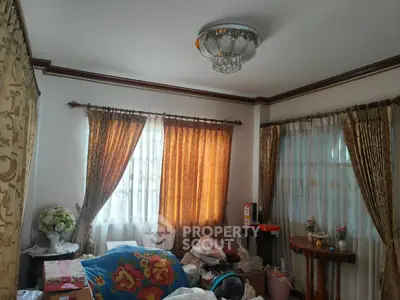 Cozy living room with elegant curtains and decorative ceiling light