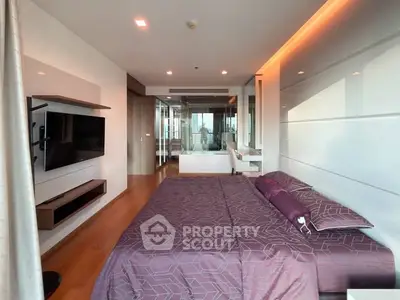 Luxurious modern bedroom with stylish decor and ambient lighting