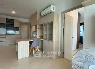 Modern open-plan living space with stylish kitchen and dining area