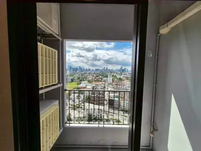 Stunning city view from a high-rise balcony with modern design.