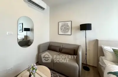 Cozy modern living room with stylish decor and comfortable seating in a contemporary apartment.