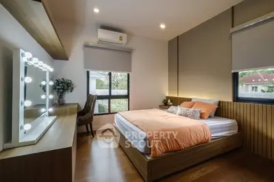 Modern bedroom with stylish decor and large window view