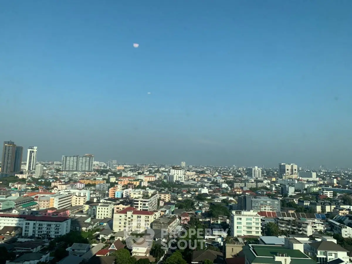 Stunning cityscape view showcasing a vibrant urban skyline under a clear blue sky.
