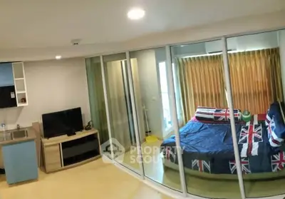 Modern studio apartment with glass partition and stylish decor
