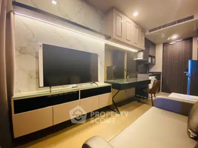 Modern living room with sleek TV setup and stylish furniture