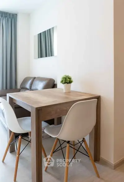 Modern living room with cozy seating and stylish dining area, perfect for urban living.