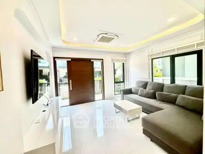 Spacious modern living room with large windows and stylish furniture