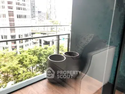 Modern balcony with city view and stylish seating area