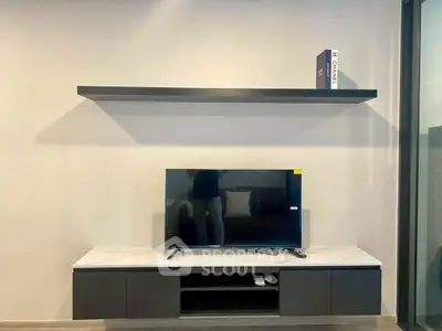 Modern living room with sleek TV stand and floating shelf