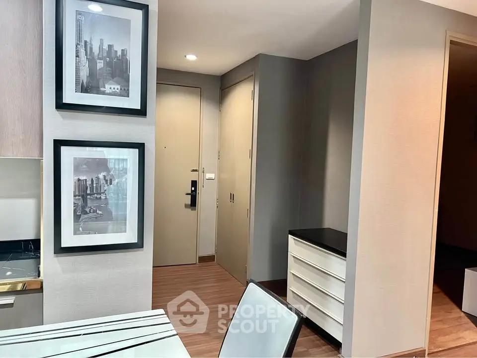 Modern apartment entrance with stylish decor and wooden flooring