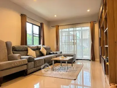 Spacious living room with modern sofa and large windows for natural light