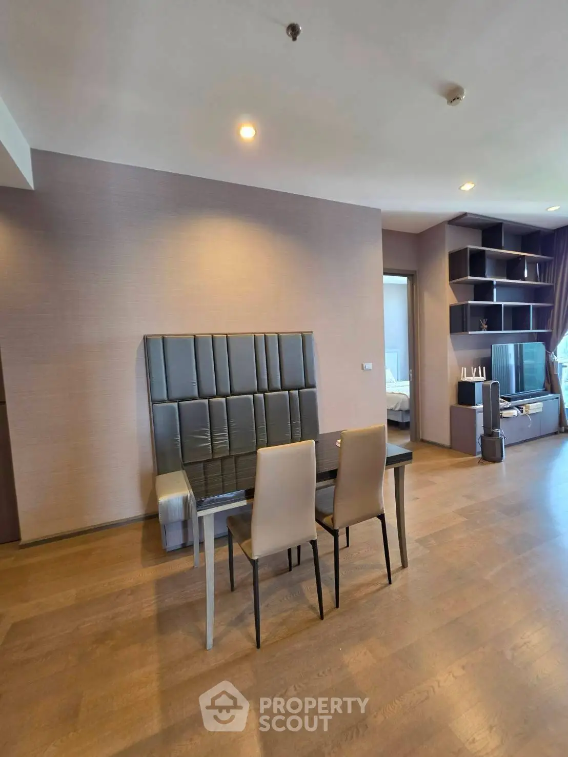 Spacious modern living room with elegant dining area and stylish shelving unit