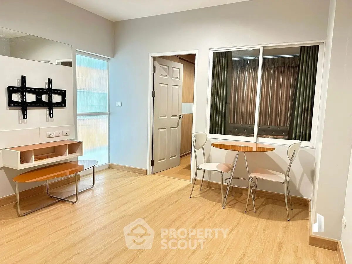 Modern apartment interior with wooden flooring and stylish furniture