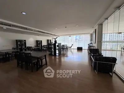 Spacious modern living room with city view and elegant furnishings