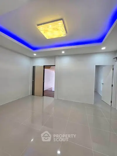 Modern interior with sleek tile flooring and ambient ceiling lighting
