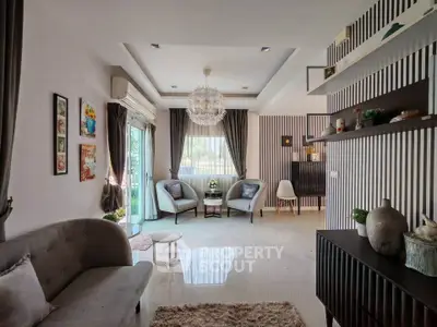Elegant living room with modern decor and stylish furniture, featuring a cozy seating area and large windows.