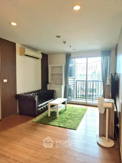 Spacious living room with balcony and city view in modern apartment