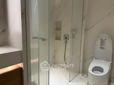 Modern bathroom with glass shower and sleek design