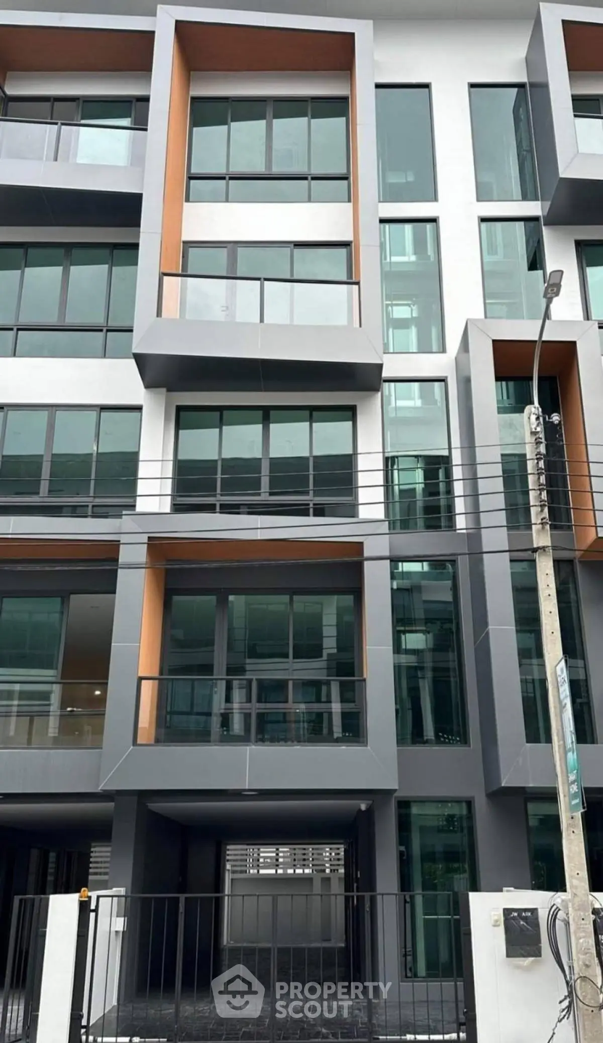 Modern multi-story building with sleek design and large windows