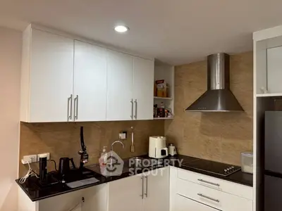 Modern kitchen with sleek cabinets and stainless steel appliances