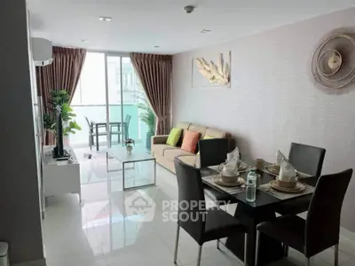 Modern living room with dining area, stylish decor, and natural light in a contemporary apartment.