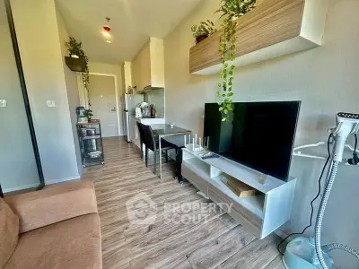 Modern living room with sleek furniture and open kitchen layout, perfect for urban living.