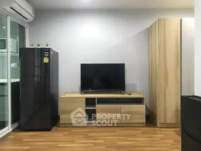 Modern living room with sleek TV stand and wooden flooring