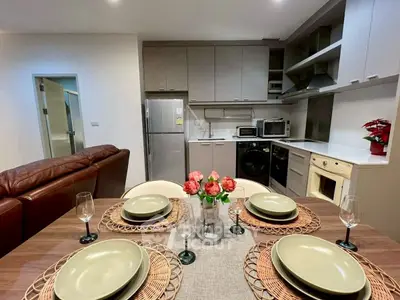 Modern kitchen and dining area with stylish decor and appliances