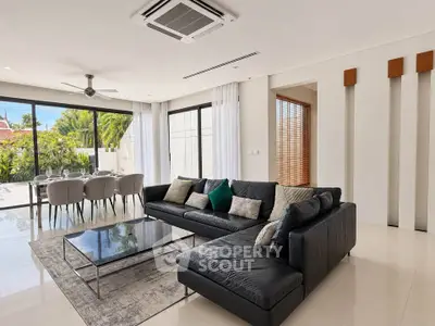 Luxurious living room with modern furniture and garden view