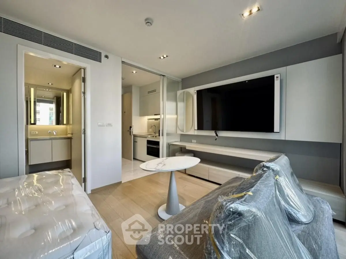 Modern living room with sleek design and open kitchen layout