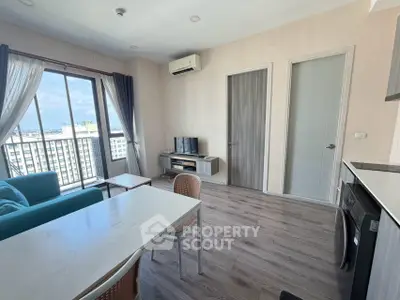 Modern living room with balcony view in high-rise apartment