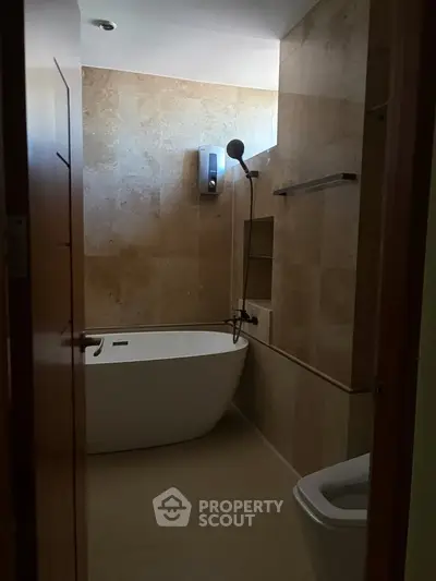 Luxurious bathroom with modern bathtub and elegant tile design