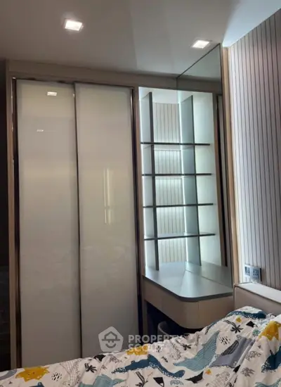Modern bedroom with sleek wardrobe and mirrored vanity