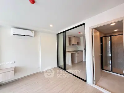 Modern apartment interior with open layout and sleek kitchen design