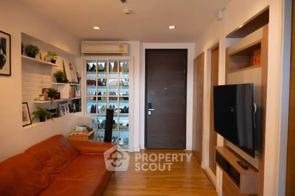 Stylish living room with leather sofa and modern decor in cozy apartment